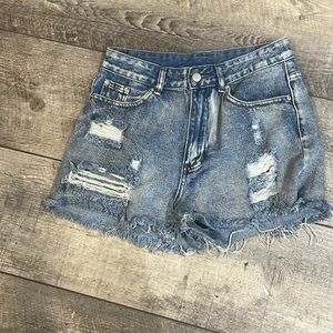 A size medium and jean shorts with rips.